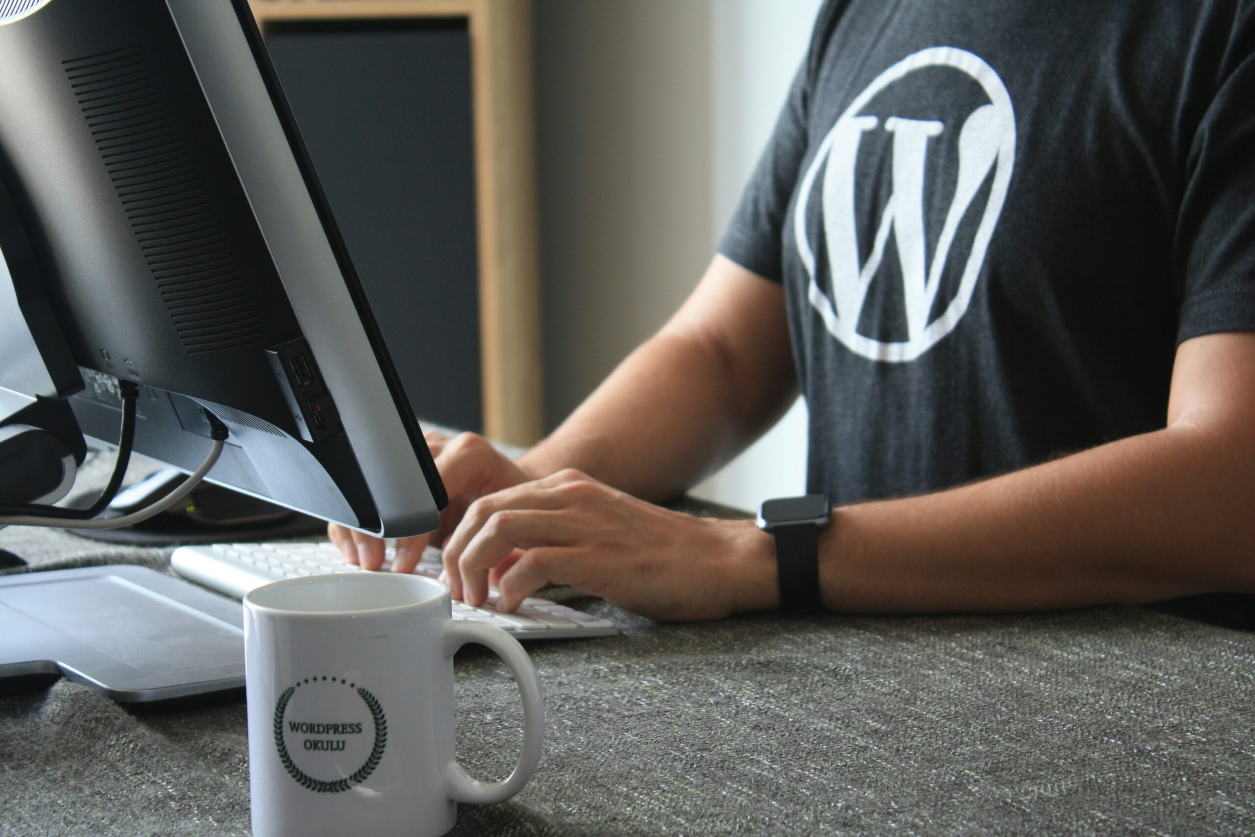 Nonprofit communications leader reviewing website management issues
